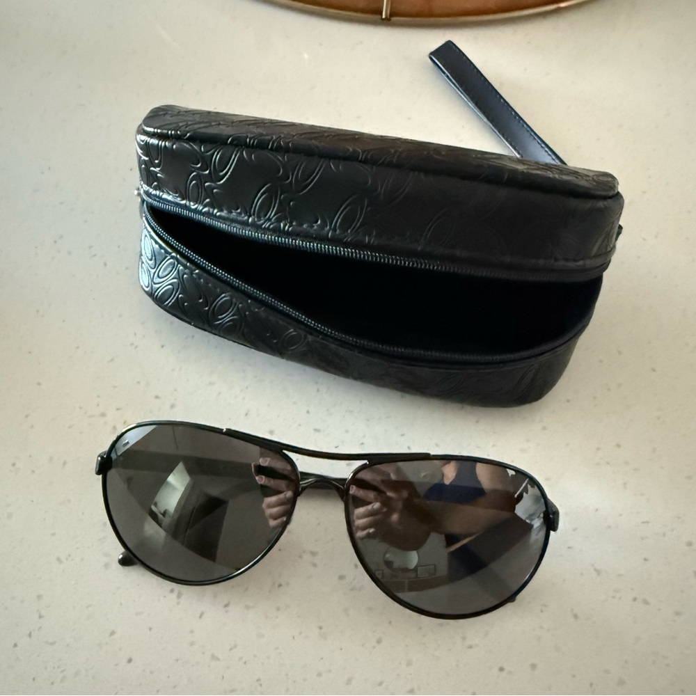 Women black Oakley sunglasses